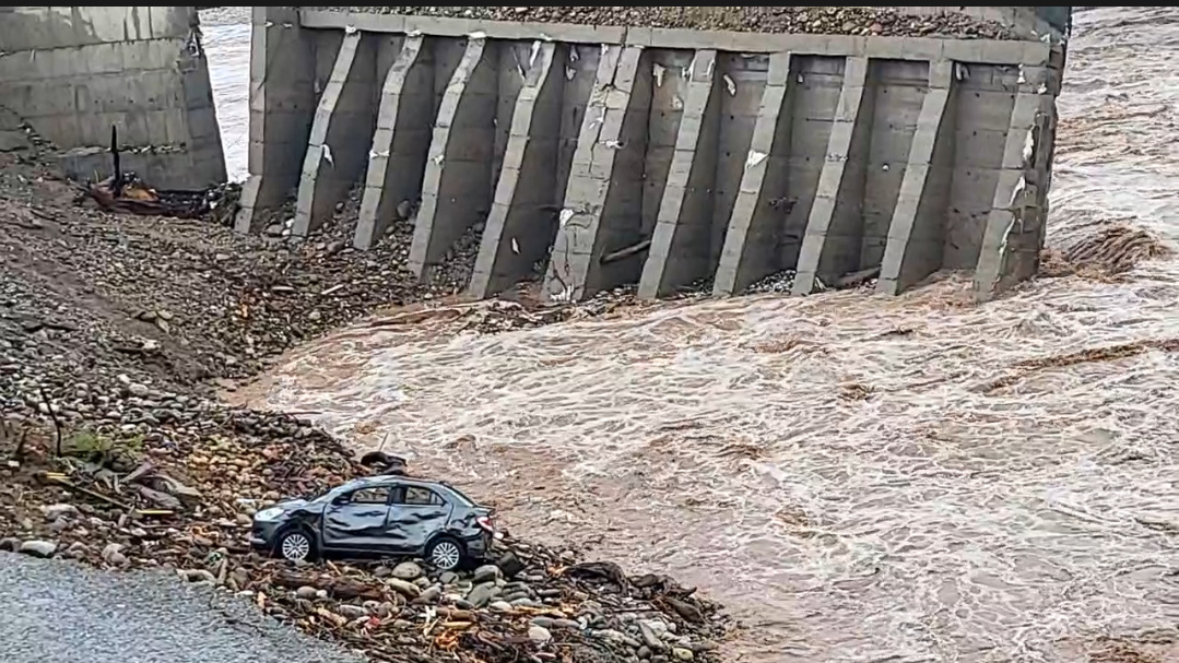 Road near the fourth Tawi Bridge Jammu has been partially washed away as water bodies swell following incessant heavy rainfall in J&K